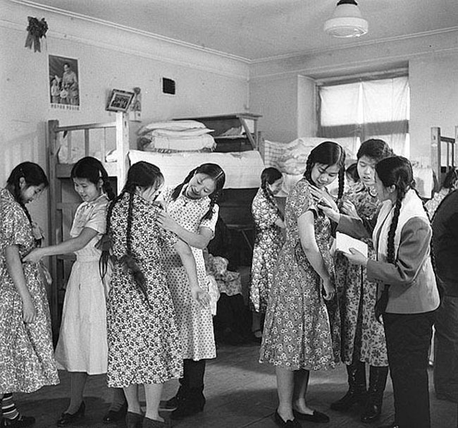 Trying on clothes in th 50s